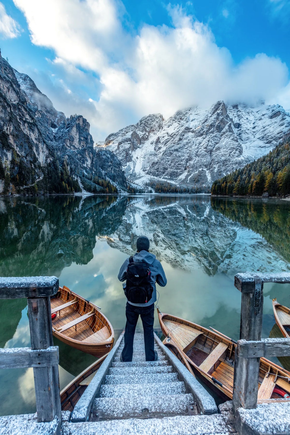 A figure on the boat dock at Lago di Braies, Dolomites